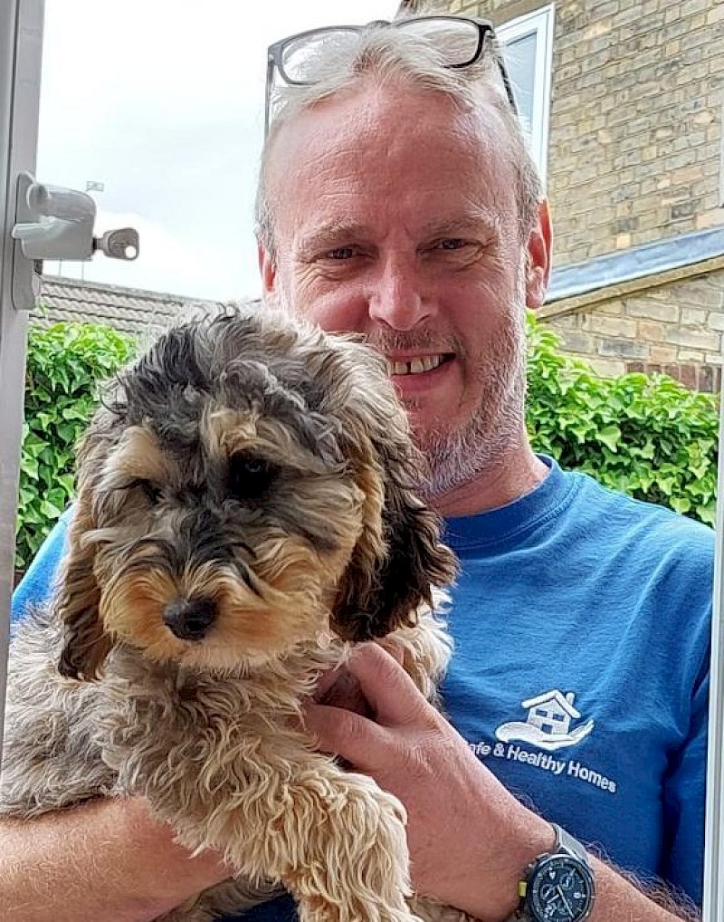 Managing Director James in branded Safe and Healthy Homes t-shirt with his cute dog