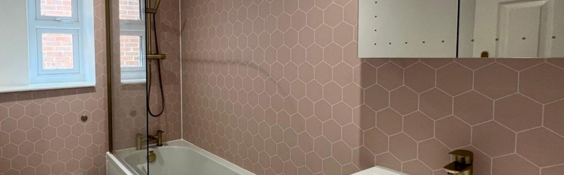 well-designed bathroom with a sink, toilet, and shower, highlighting professional installation and repair services