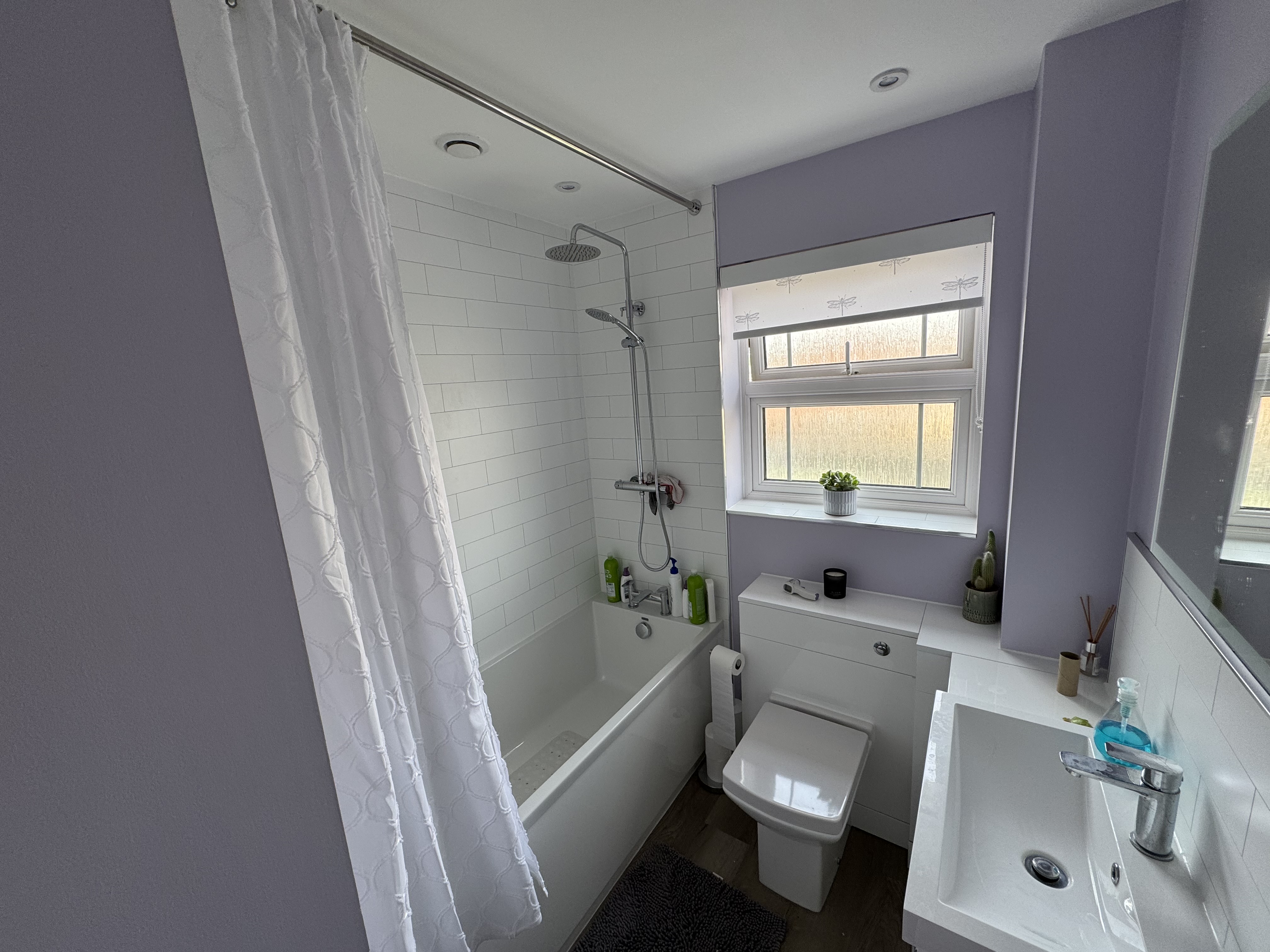 well-designed bathroom with a sink, toilet, and shower, highlighting professional installation and repair services