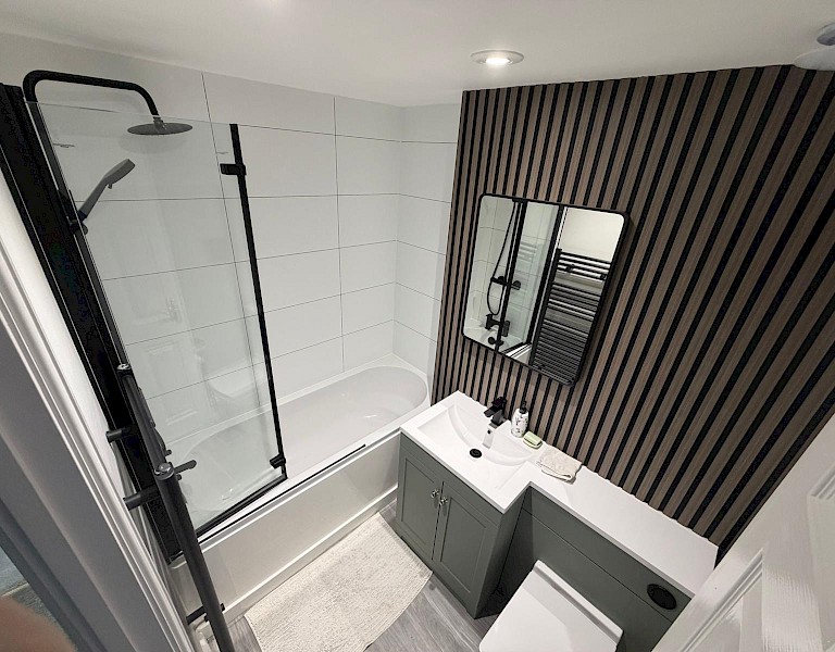 well-designed bathroom with a sink, toilet, and shower, highlighting professional installation and repair services