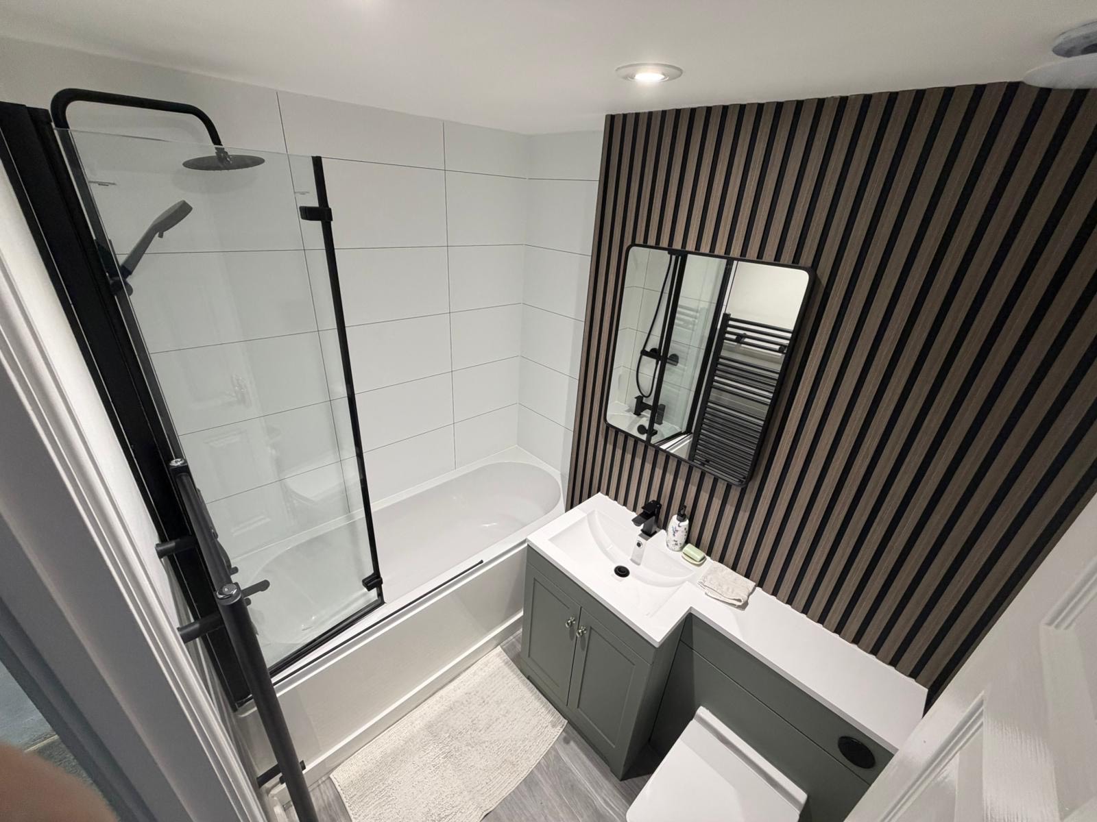 well-designed bathroom with a sink, toilet, and shower, highlighting professional installation and repair services