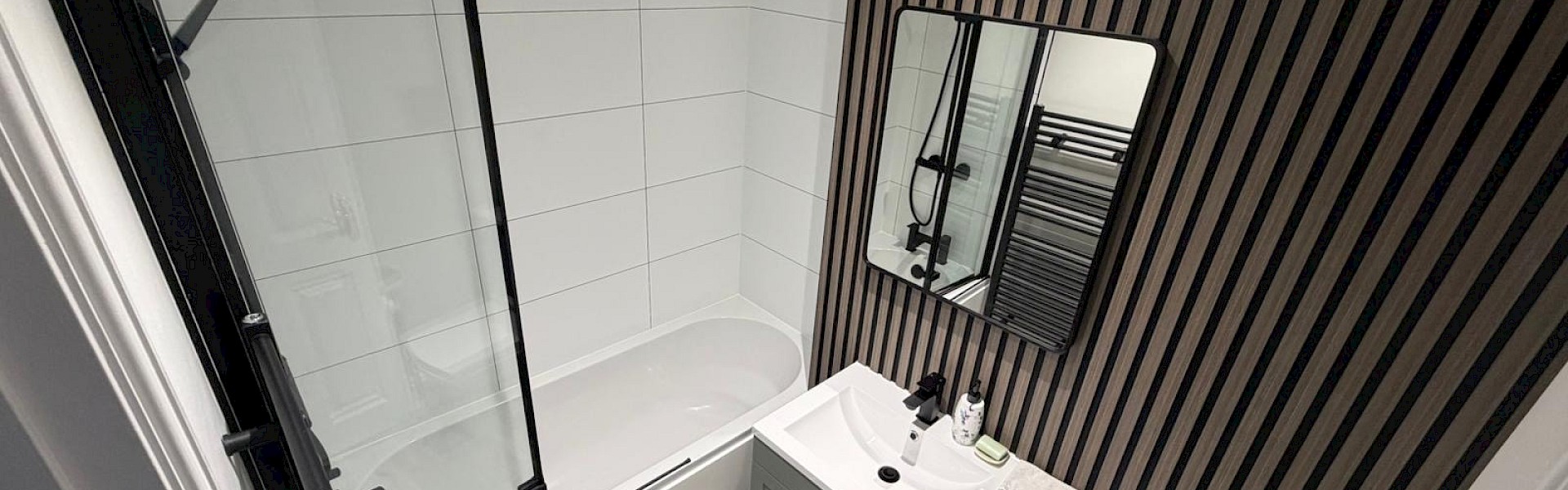 well-designed bathroom with a sink, toilet, and shower, highlighting professional installation and repair services
