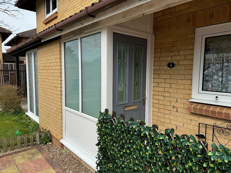 Brand new green front door of brick house recently installed