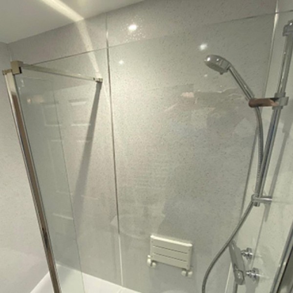 shower with a glass door and contemporary shower head, perfect for bathroom repair and renovation designs