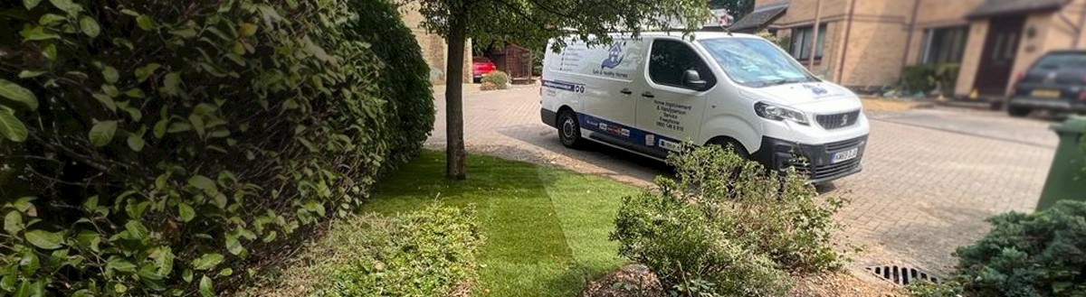 Green garden landscape with handyperson van in the background for Safe and Healthy Homes