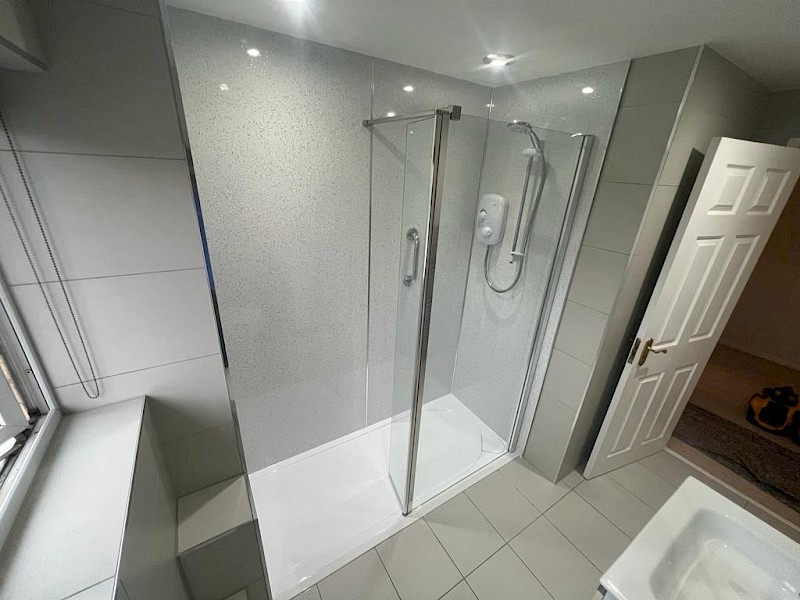 stylish bathroom equipped with a shower and toilet, emphasizing expert renovation and installation craftsmanship