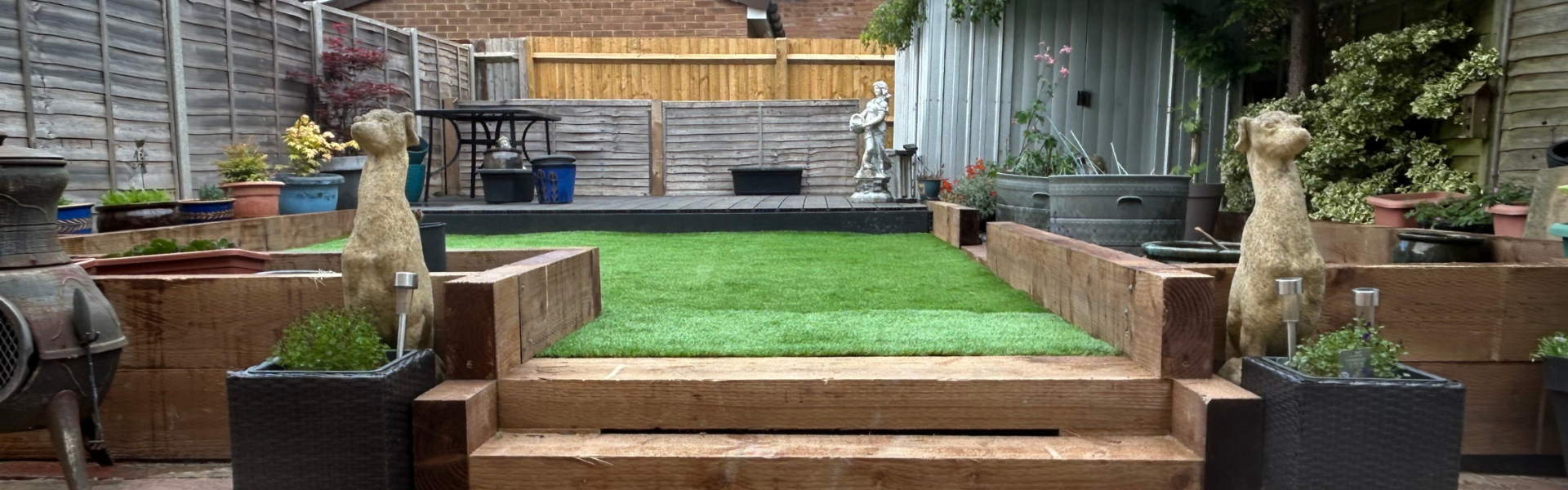 Green garden landscape with handyperson van in the background for Safe and Healthy Homes